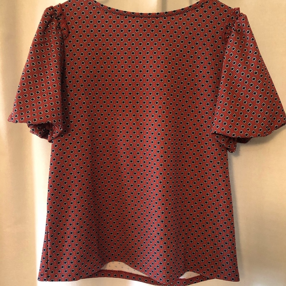 Ann Taylor patterned top with ruffle accent